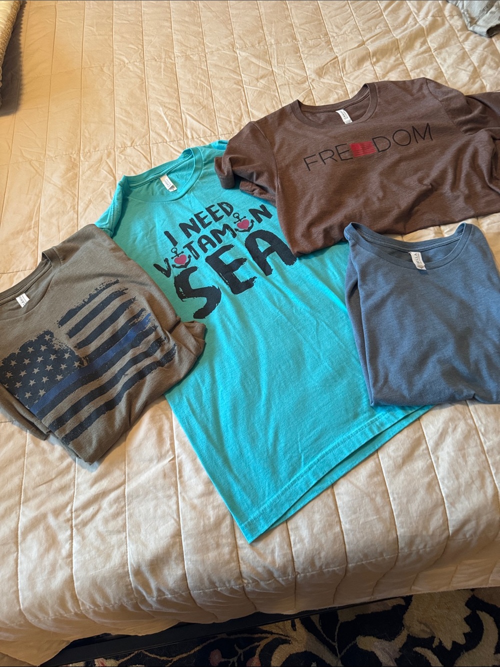 Bella Canvas Tees, like new.  4 included M